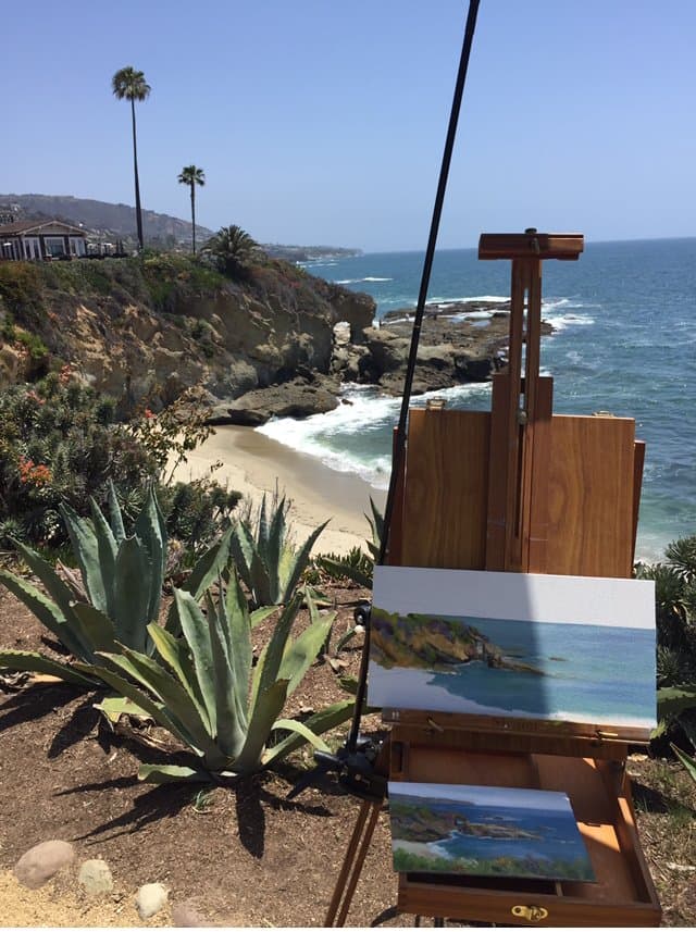 Cynthia's easel on the bluff above a Laguna Beach cove, a small painting of the view in progress.